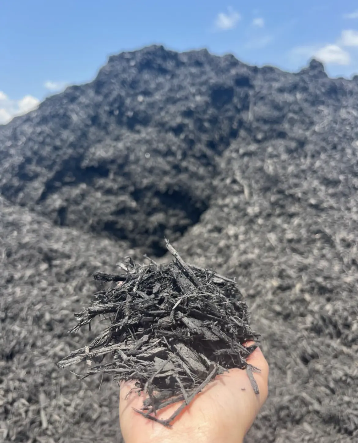 Black Mulch Pile in Stone Yard