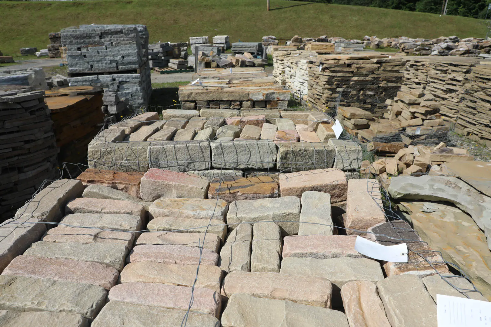 Tumbled Cobble Brown Stone In Stone Yard