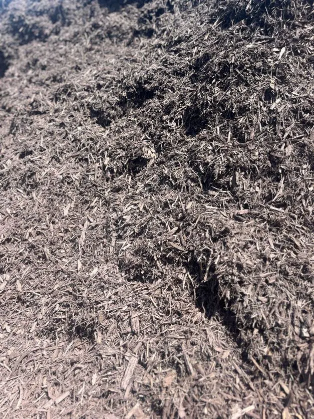 Dark Brown Mulch Pile in Stone Yard